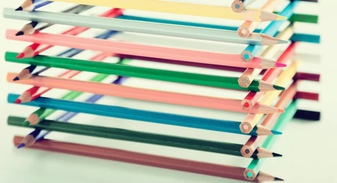 colored pencils stacked like a log house